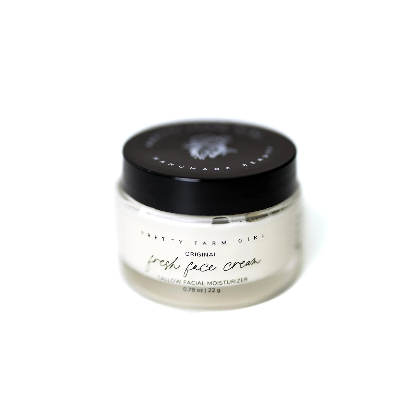 Pretty Farm Girl Original Fresh Face Cream Tallow Facial Moisturizer in clear jar with black lid