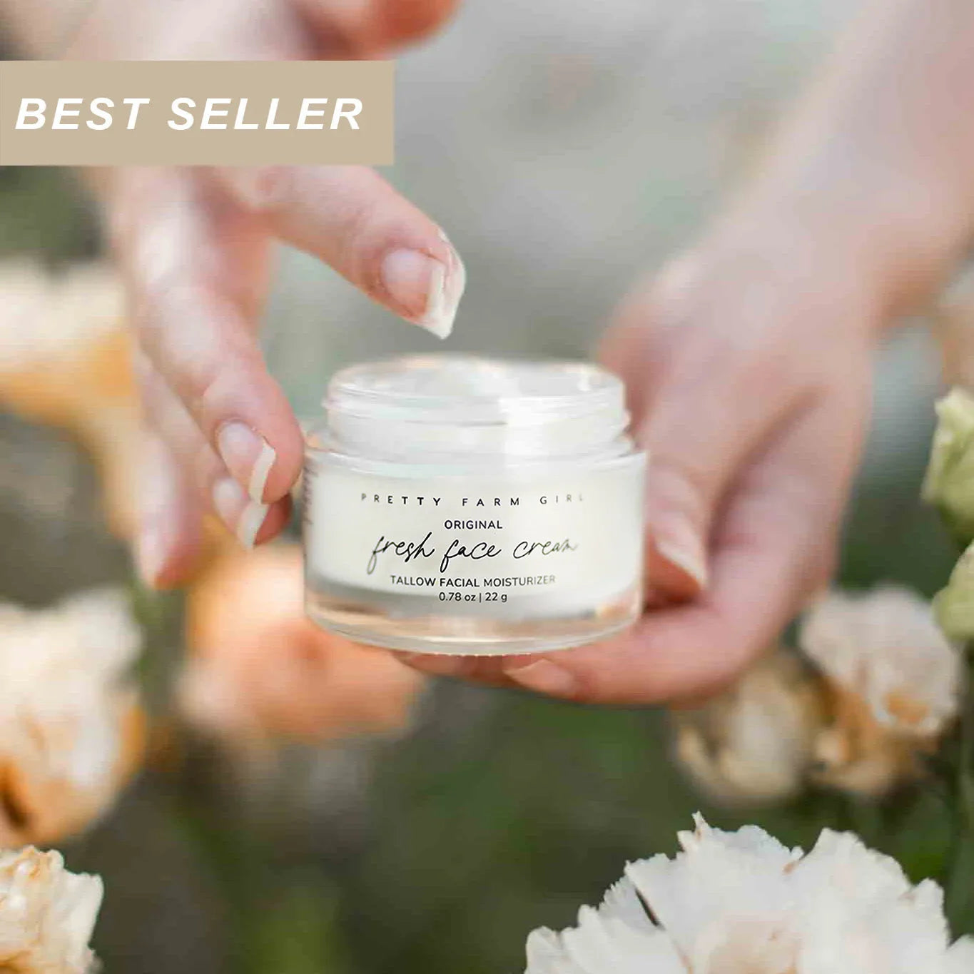 Best seller fresh face cream tallow facial moisturizer held in hands with flowers