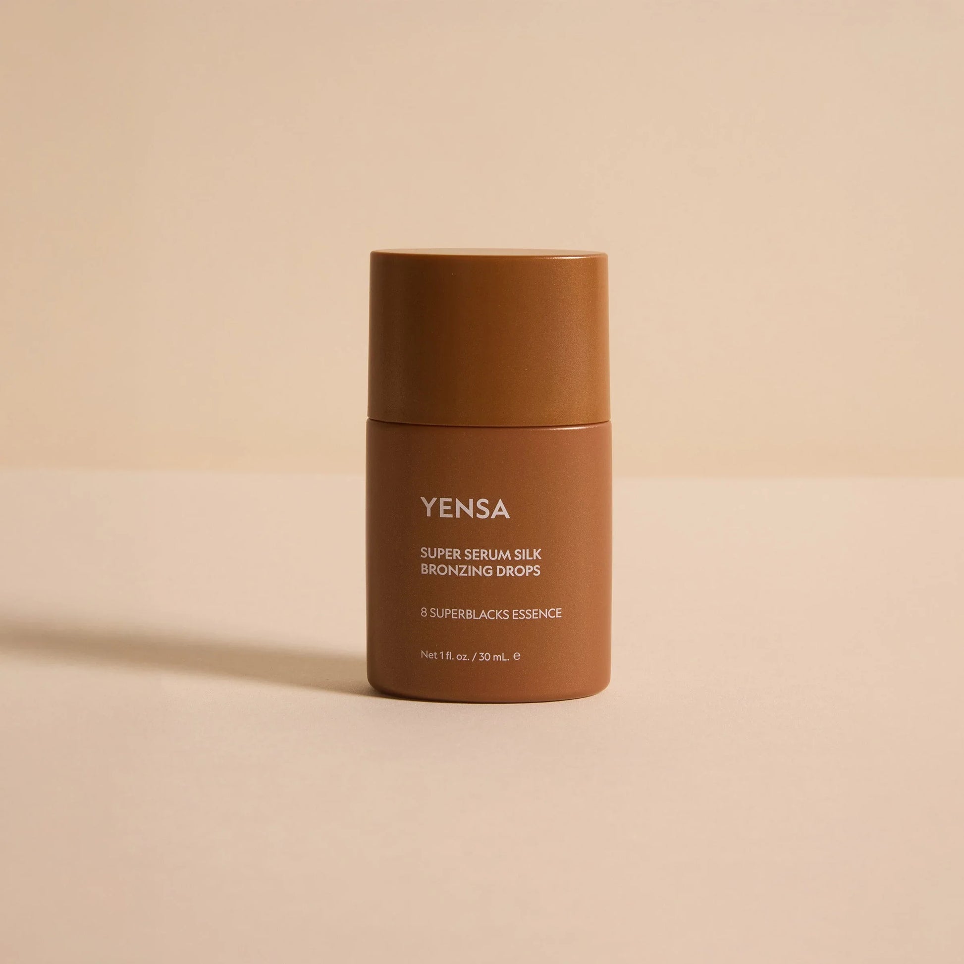 YENSA Super Serum Silk Bronzing Drops in matte brown bottle, 30ml, with 8 Superblacks Essence for radiant glow