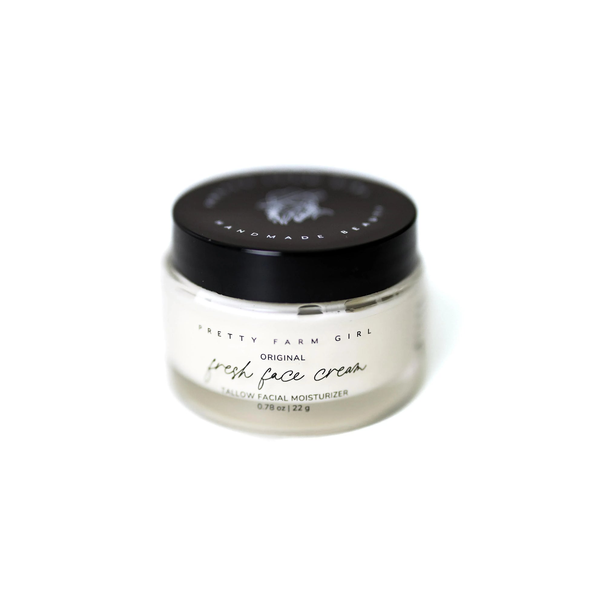 Pretty Farm Girl Original Fresh Face Cream Tallow Facial Moisturizer in clear jar with black lid